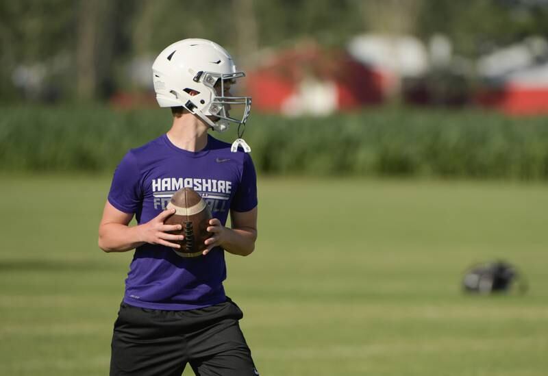 Hampshire quarterback Triston Collins looks for a receiver during a 7 on 7 football in Maple Park on Tuesday, July 12, 2022.