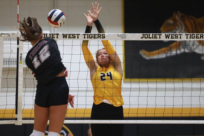 Joliet West’s Natalia Harris goes for the block against Plainfield North on Wednesday, Sept. 6, 2023 in Joliet.