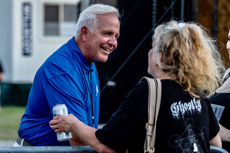 Joliet Mayor Terry D'Arcy chats with Tina Damico at Busey Bank Field at Joliet Memorial Stadium during Taste of Joliet on June 20, 2025.