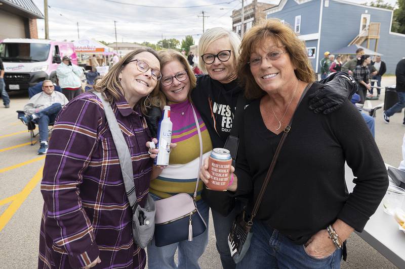 Dixon High School Class of 1980 friends Mary Joyce (left), Angie Tennyson, Kathy Gridely and Rhonda Donegan-Smith celebrate a reunion Saturday, Sept. 6, 2025, at Dement Town Music Fest.