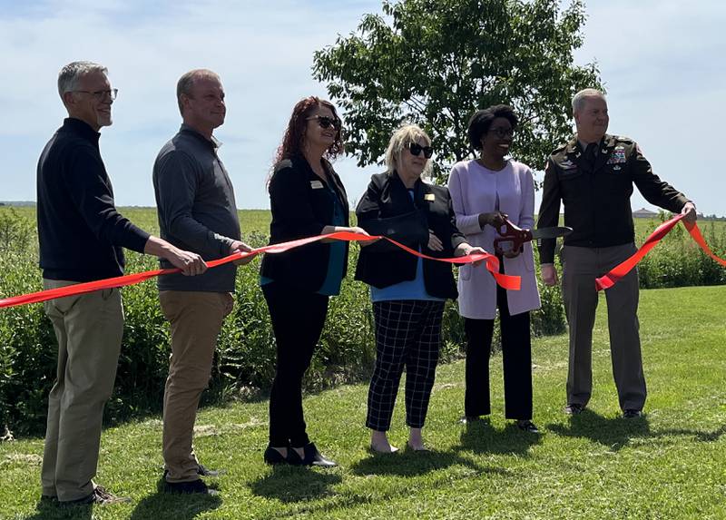 A ribbon-cutting ceremony was held on Friday, May 31, to celebrate the ecosystem restoration project at the Prairie Bluff Forest Preserve in Crest Hill. The ceremony was attended by Ralph Schultz, executive director of the Will County Forest Preserve (left); Andrew Hawkins, director of conservation for the Will County Forest Preserve; Will County board member Meta Muller; Annette Parker, president of the Will County Forest Preserve board; U.S. Rep. Laurie Underwood and Col. Kenneth Rockwell, commander of the U.S. Army Corps of Engineers Chicago District.