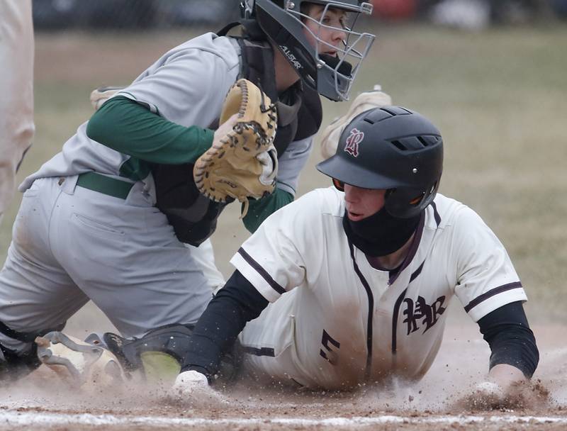 Prairie Ridge's Zachary Bentsen slides into home base under the tag of Fremd’s Nico Cocillia during a non-conference baseball game Tuesday, March 29, 2022, between Prairie Ridge and Fremd at Prairie Ridge High School.