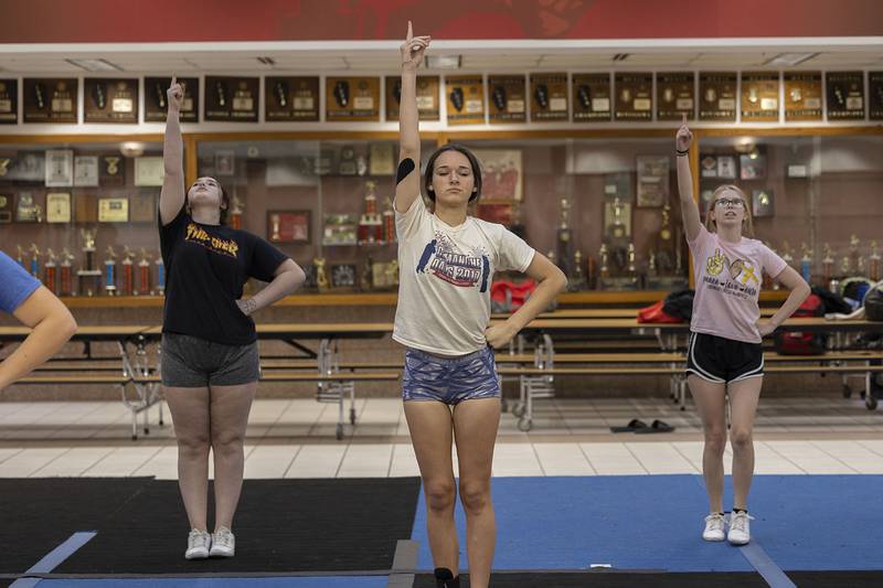 Brianna Goodhart practices with her Erie-Prophetstown cheer squad Wednesday, Jan. 18, 2023. The team will perform a variety of stunts  backed by musical numbers during the sectional competition on Saturday.