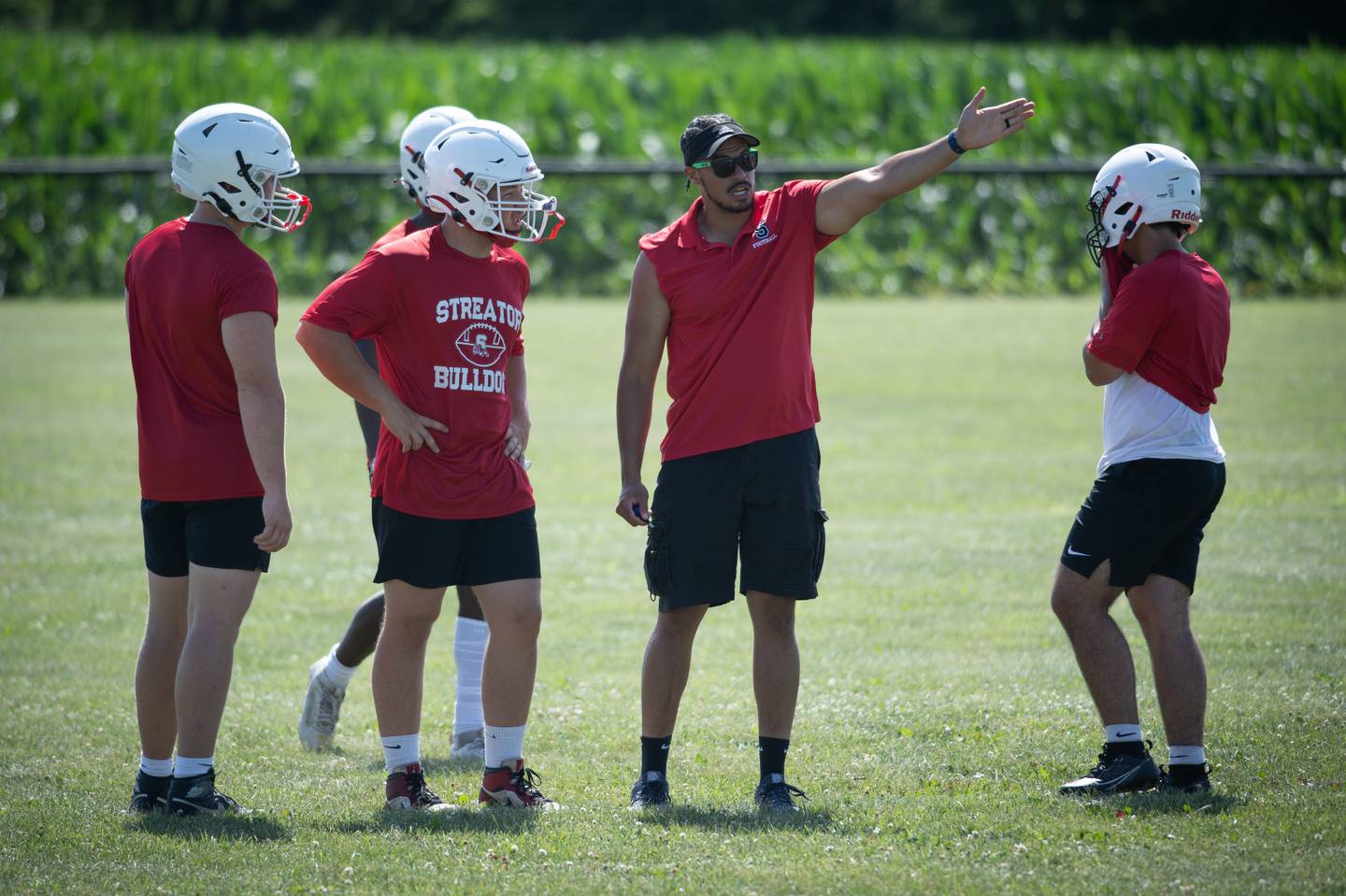 Streator's head coach Jay Slone talks with players during the 7 on 7 football at Central High School on Saturday, July 12, 2025.