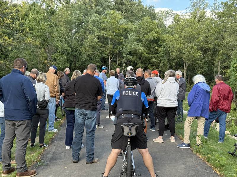 A crowd listens as Scott Nadeau, executive director for the Sugar Grove Park District, speaks during a ribbon cutting for the Bridge at Belle Vue Park on Sept. 5, 2025, in Sugar Grove.