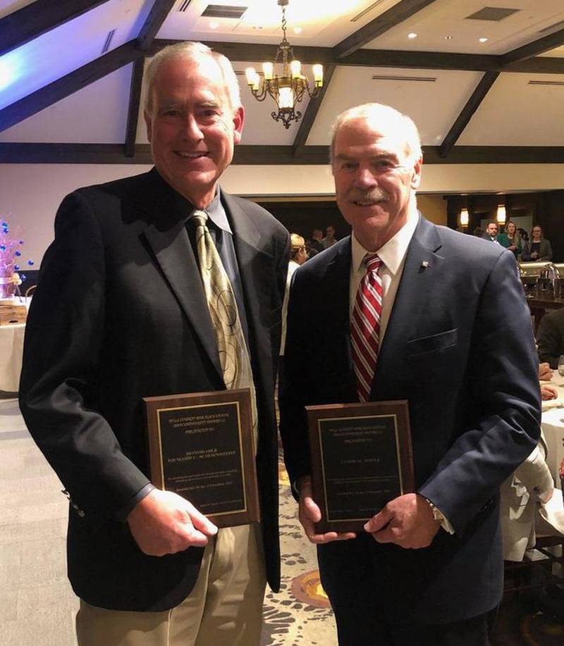 Judge Richard Schoenstedt (left) and James Roolf received community service awards from the Will County Bar Association on Dec. 5.