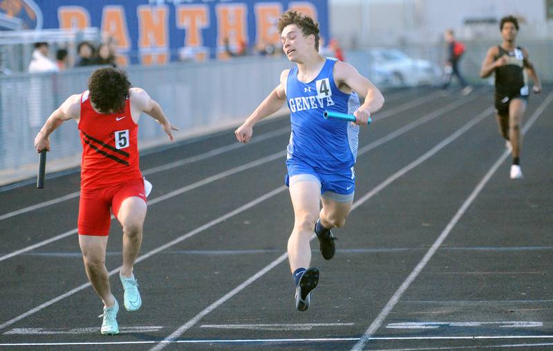 Aurora East's Samuel Lopez (left) edges Geneva's Toby Jens across the finish line in the varsity 4x200 Meter Relay during the Roger Wilcox Invitational at Oswego High School on Friday, Apr. 28, 2023.