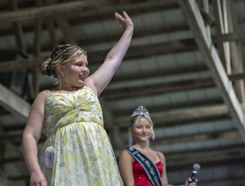 Lexie Quinn, 11, waves in the Ogle County Young Miss pageant Thursday, July 30, 2025, at the Ogle County Fairgrounds.