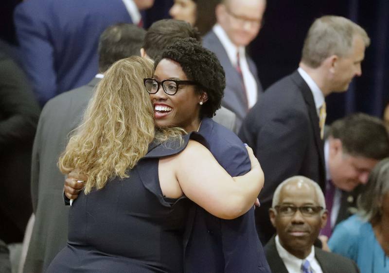 U.S. Rep. Lauren Underwood, D-Naperville, greets an unidentified person before President Joe Biden speaks Wednesday, July 7, 2021, at McHenry County College in Crystal Lake.