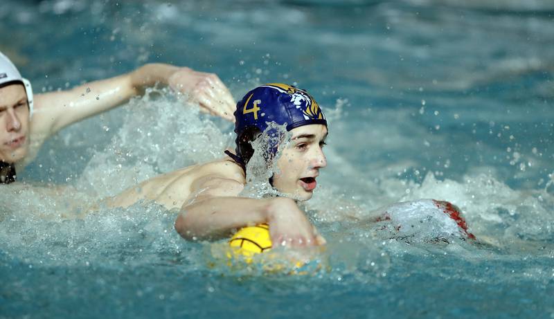 Lyons' Luke Jackson (4) moves towards the goal against against the York during the IHSA State Water Polo consolation match Saturday May 20, 2023 at Stevenson High School in Lincolnshire.