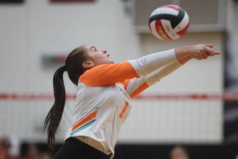 Plainfield East’s Melanie White runs down the ball against Plainfield North on Thursday night.