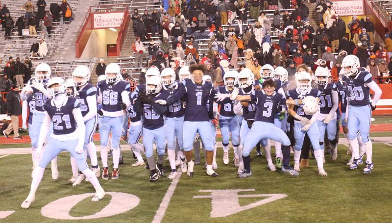 Members of the DePaul football team react after winning the Class 4A State football championship on Friday, Nov. 29, 2024 at Hancock Stadium in Normal.
