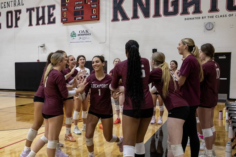 Lockport's Katelyn Nelson gives high-fives to teammates while being introduced prior to the 4A L-W Central Regional varsity volleyball game against Plainfield North at Lincoln-Way Central on Oct. 30, 2025.