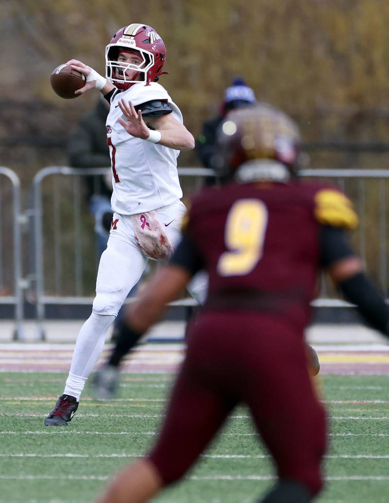 Morris' Brady Varner (7) looks for an open teammate during the IHSA Class 4A semifinals football playoff game Saturday, Nov. 22, 2025 in Lombard.