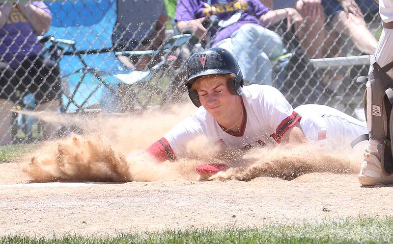 Hall's Max Bryant slides into home to scores a run against Sherrard during the Class 2A Sectional final game on Saturday, May 27, 2023 at Knoxville High School.