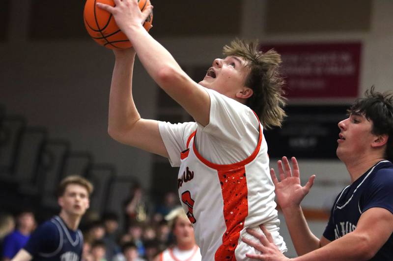 McHenry’s Nathan Ottaway works under the hoop against Cary-Grove in varsity boys basketball on Tuesday, Feb. 17, 2026, at McHenry High School in McHenry.