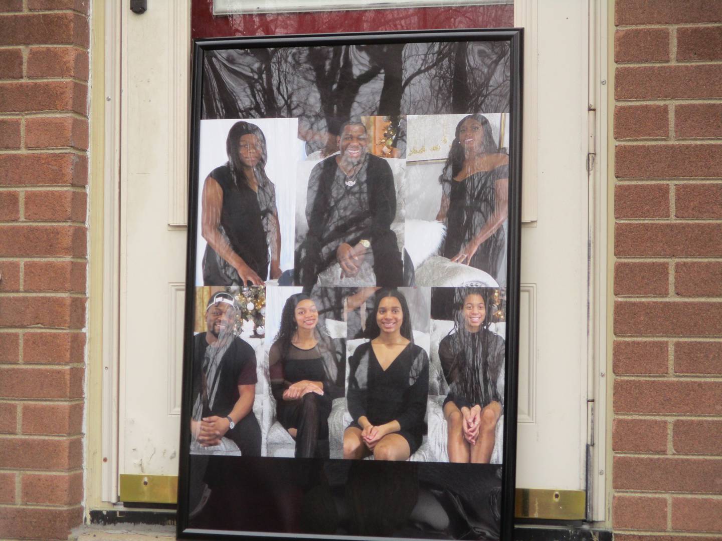 A composite photograph of the members of the Nance and Esters families who lost their lives in the Jan. 21 shootings in Joliet was posted at the front door of the Esters' house on West Acres Road for a vigil held Sunday. Jan. 28, 2024.