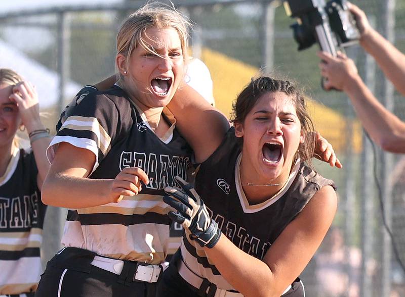 Sycamore players celebrate after their Class 3A sectional championship win over Sterling Friday, June 2, 2023, at Belvidere North High School.