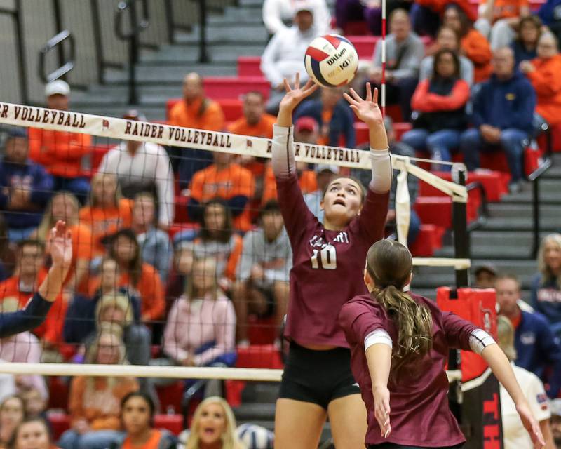 Lockport's Natalie Bochantin (10) sets a shot during Class 4A Bolingbrook Sectional final match between Lockport at Oswego.  Nov 7, 2024  in Bolingbrook.