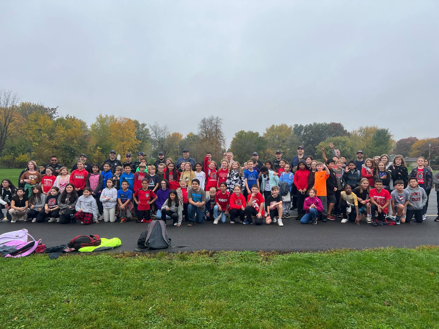 Students at Northbrook Middle School pose with first responders after the kickball game Friday, Oct. 27, 2023, in Mendota.
