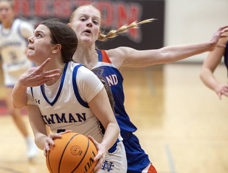 Newman’s Helen Papoccia drives to the hoop past Eastland’s Violet Diehl Tuesday, Feb. 18, 2025, during the Class 1A girls basketball regional at Forreston.
