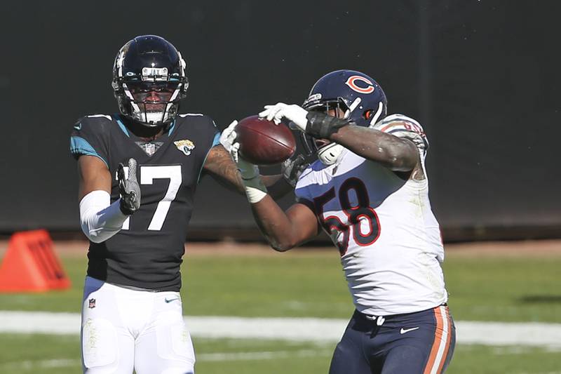 Chicago Bears linebacker Roquan Smith (58) intercepts a pass intended for Jacksonville Jaguars wide receiver DJ Chark Jr. (17) during the first half of an NFL football game, Sunday, Dec. 27, 2020, in Jacksonville, Fla. (AP Photo/Stephen B. Morton)