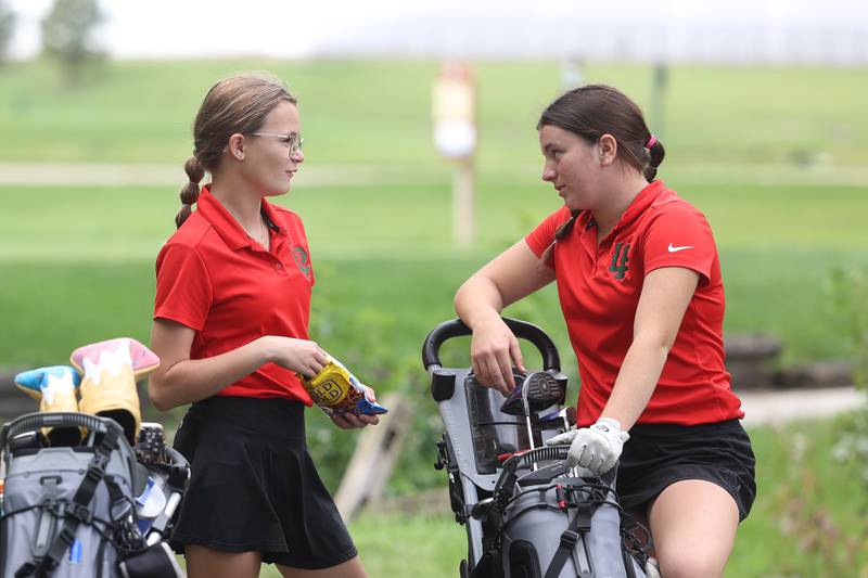 Lasalle’s Delani Duggan, left, and Allie Thome talk while waiting to tee off hole 1 in the Class 2A Bradley Regionals at the Green Garden Country Club in Frankfort on Thursday, Sept. 28, 2023.