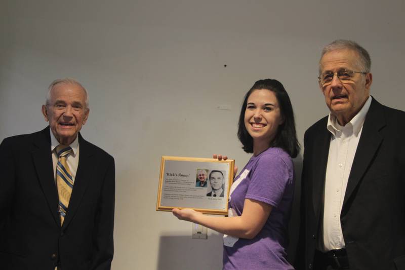 Ron Rynke (left) Illinois Valley Community College SGA President Nicolette Kendall and Rich Rynke at a ceremony Tuesday, May 10, 2022. Kendall hung the plaque honoring Rick Rynke in the Student Life Center.