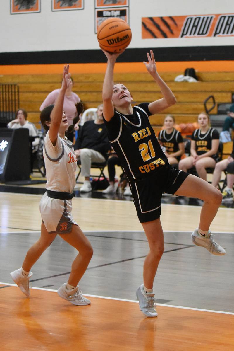 Reed-Custer's Alyssa Wollenzein, right, lays it up in front of Beecher's Madison Smith during a game at Beecher Tuesday, Jan. 20, 2026.