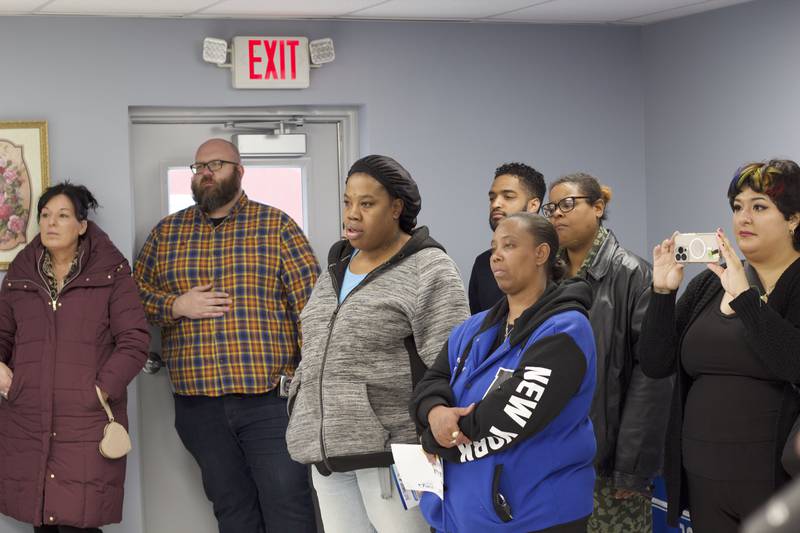 Attendees at a ribbon-cutting ceremony on Monday, April 21, 2025, for the food pantry at the Joliet Township Forest Park Community Center in Joliet.