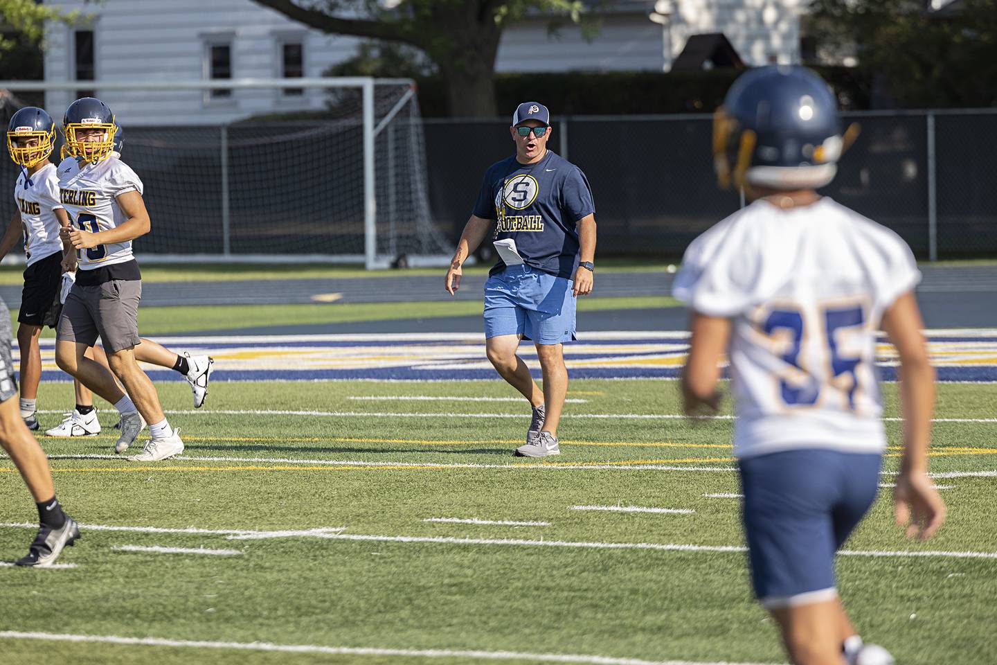 Sterling coach Jon Schlemmer leads his team against Newman during 7 on 7 drills Thursday, July 20, 2023.