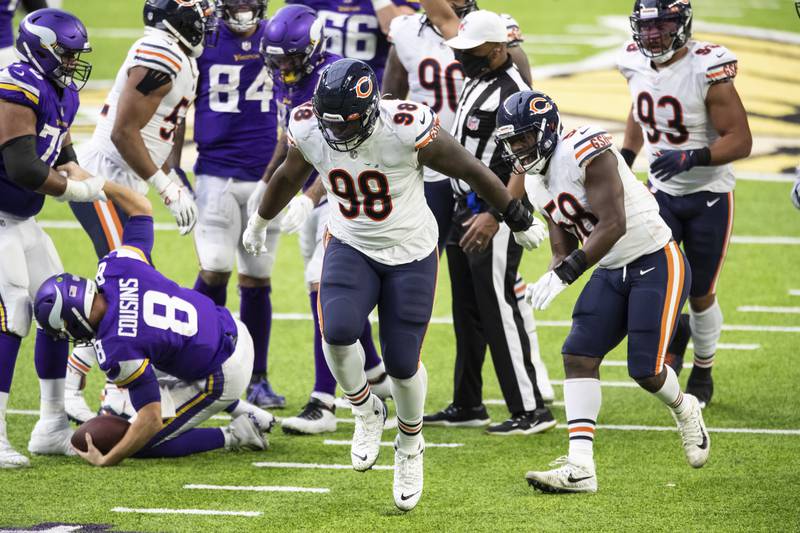 Chicago Bears nose tackle Bilal Nichols, center, celebrates after recording a sack against Minnesota Vikings quarterback Kirk Cousins in the fourth quarter Sunday, Dec. 20, 2020, in Minneapolis. The Bears defeated the Vikings 33-27.