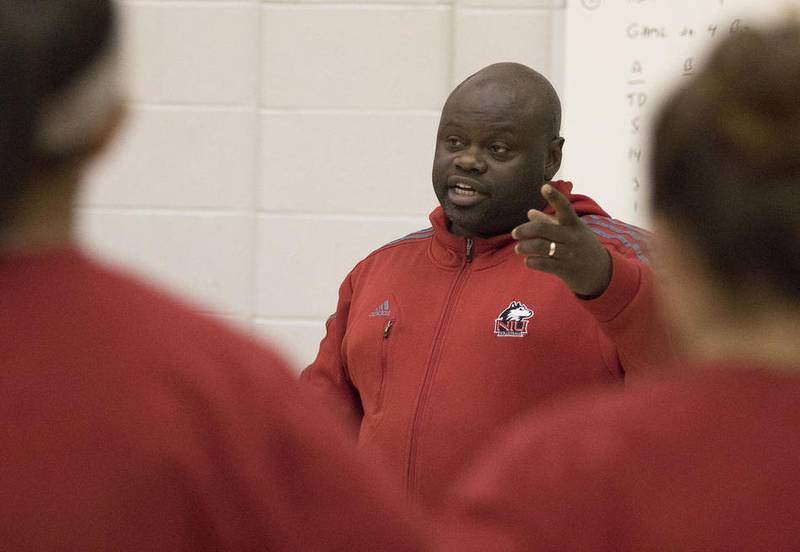 NIU volleyball coach Ray Gooden goes over strategy with the team during practice at the Convocation Center on Tuesday, September 20, 2016 at Northern Illinois University in DeKalb.