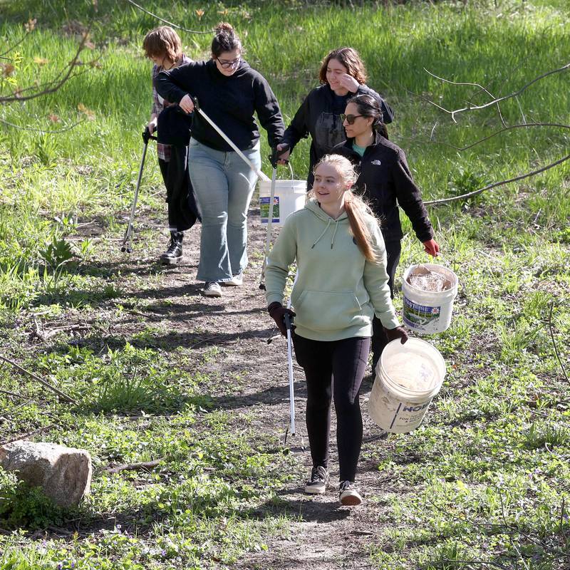 A group from a Kishwaukee College Environmental Biology class helps out Monday, April 22, 2024, during an Earth Day Clean Up event at Hopkins Park in DeKalb.