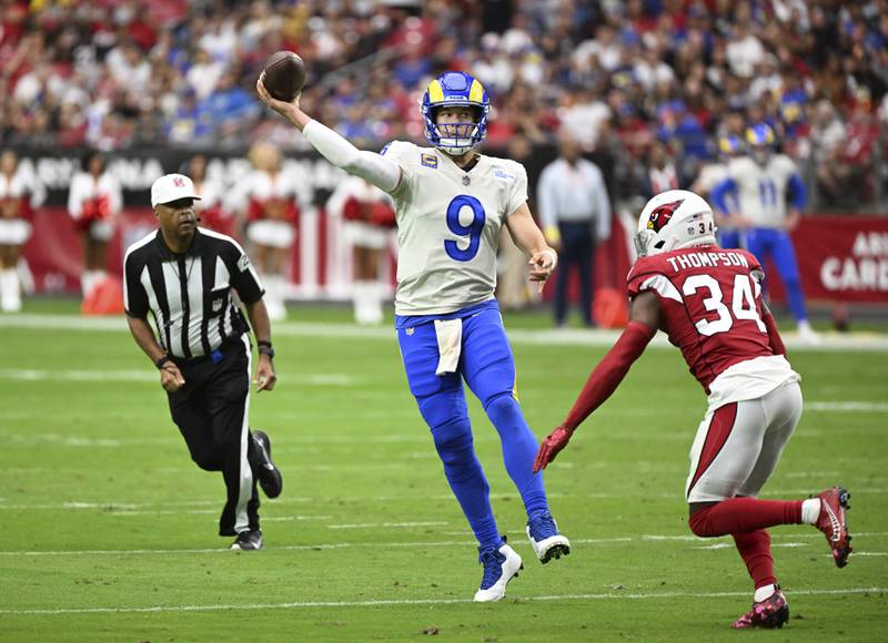 Los Angeles Rams quarterback Matthew Stafford (9) throws a pass on the run during an NFL football game against the Arizona Cardinals, Sunday, September 25, 2022 in Glendale, Ariz. The Rams defeated the Cardinals 20-12. (John Cordes/AP Images for Panini)