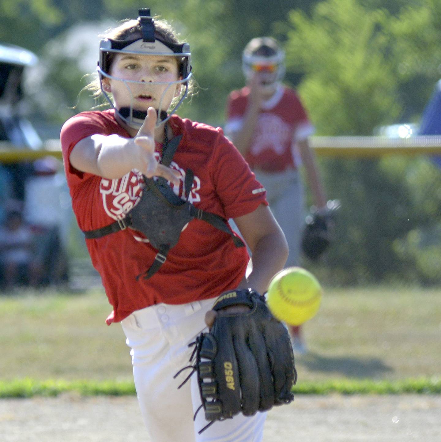 Dairy Queen pitcher Hadley Davies lets go with a pitch to a MJ Track Works batter in Wednesday's Streator Girls Softball 14U city title game at Bodznick Park in Streator.
