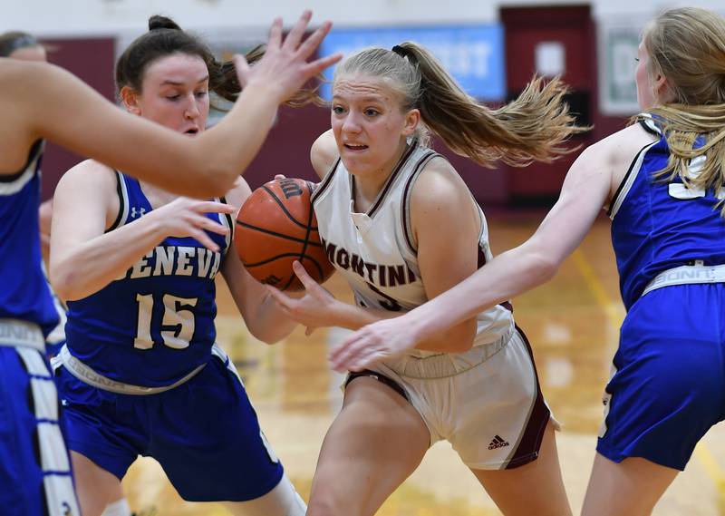Montini's Victoria Matulevicius drives through a crowd of Geneva defenders including Cassidy Arni (15) during a Coach Kipp Hoopsfest game on Jan. 14, 2023 at Montini Catholic High School in Lombard.