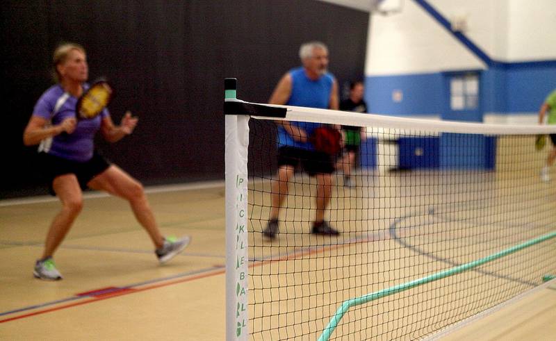 Participants play a game of pickleball in St. Charles. Communities such as Streator continue to see rising interest in the game, leading the Streator Family YMCA to break ground on an outdoor pickleball facility later this month.