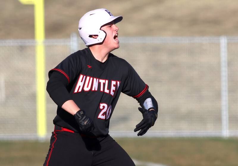 Huntley’s Haiden Janke celebrates after knocking an RBI single in varsity baseball at McHenry Friday night.