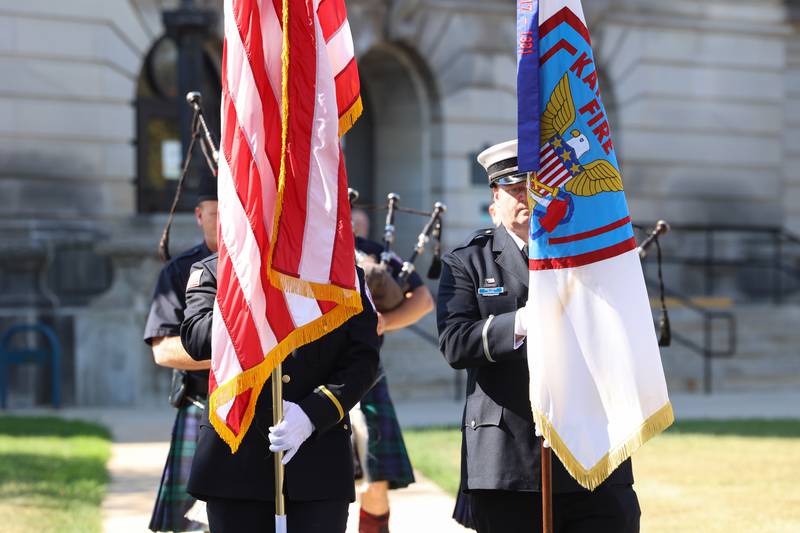 Kankakee Fire Department Lt. Brian Porter, right, and Bourbonnais Fire Protection District Lt. Wyatt Gustafson proceed to post the colors during the 44th Kankakee County Fallen Firefighter Memorial Service on Friday, Oct. 3, 2025. Porter also serves as the Bradley Fire Department deputy chief.