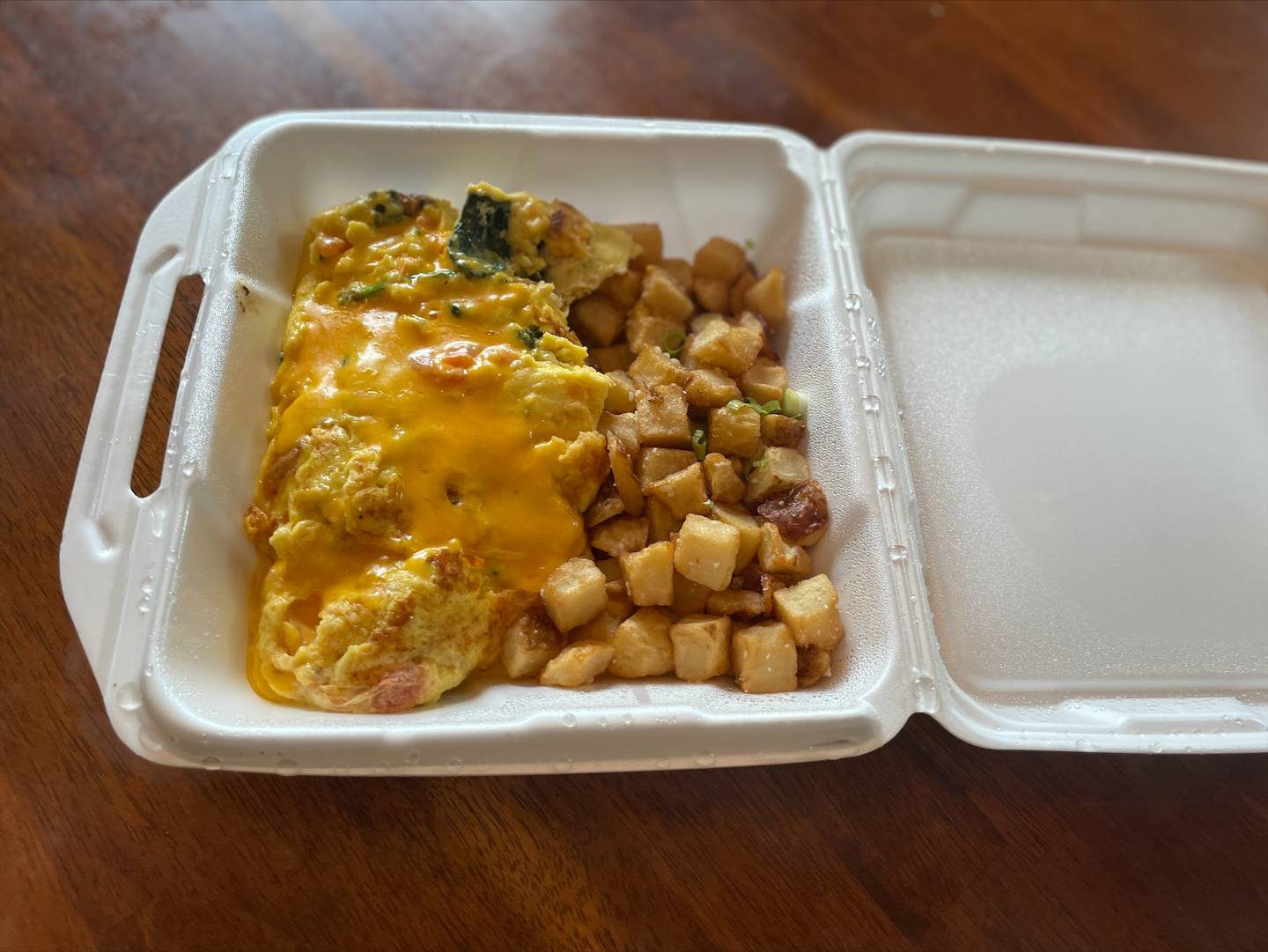 Build your own omelette with extra American cheese, spinach and tomatoes with a side of potatoes from Eggceptional Cafe, 2749 Algonquin Rd., Algonquin.