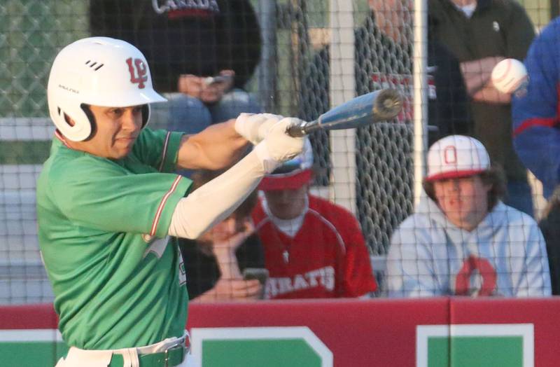 L-P's Alex Galindo makes contact with the ball against Ottawa at Huby Sarver Field inside the L-P Athletic Complex on Tuesday, April 23, 2024 in La Salle.