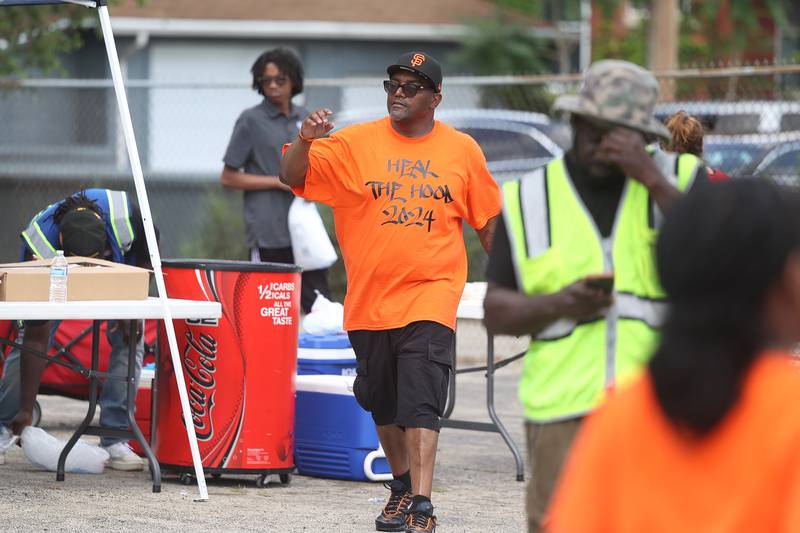 Jaron Nabors Sr., one of the event organizers, makes his rounds at the Healing the Hood event at St. Mark CME Church in Joliet on Saturday, June 29, 2024.