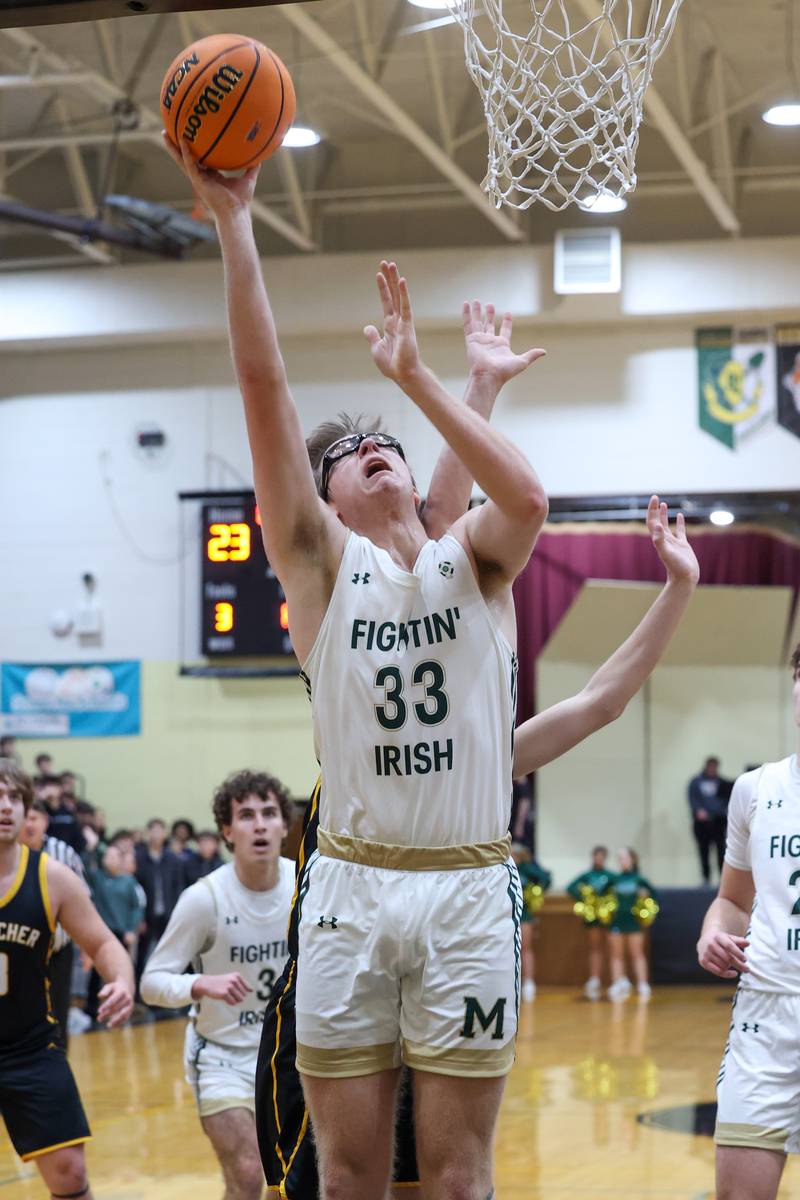 Bishop McNamara's Callaghan O'Connor hits a layup during Bishop McNamara's 71-42 victory over Herscher in the IHSA Class 2A Herscher Regional semifinal on Wednesday, Feb. 25, 2026.
