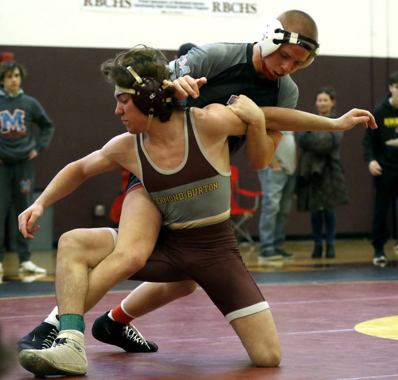 Marian Central’s Charlie Fitzgerald controls Richmond-Burton’s Brody Rudkin in their 145-pound championship wrestling match in the IHSA 1A Richmond-Burton Wrestling Regional Thursday, Jan. 19, 2023, at Richmond-Burton High School in Richmond.