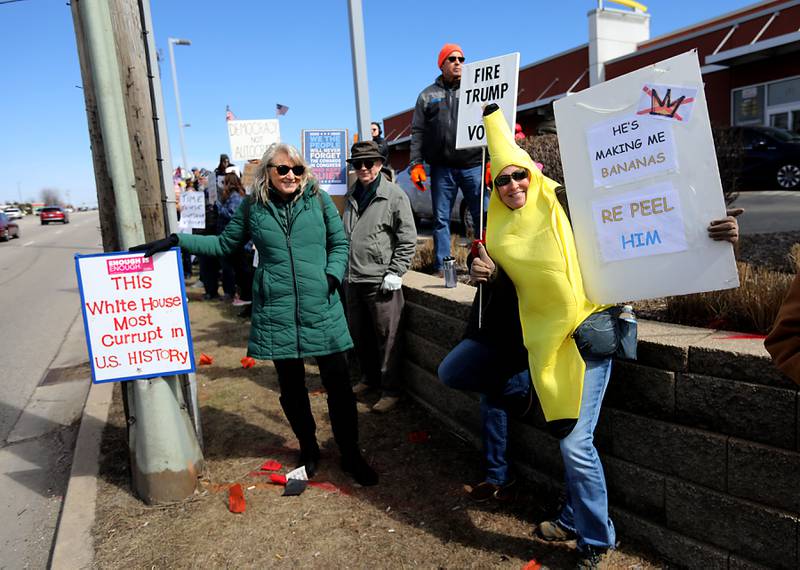 Protesters line State Route 31 near the intersection of McCullom Lake Road in McHenry to protest their discontent with President Donald Trump and his administration's policies on Saturday, March 28, 2026, during the McHenry County No Kings Protest. According to an organizer, over 4,000, people took part in the protest.