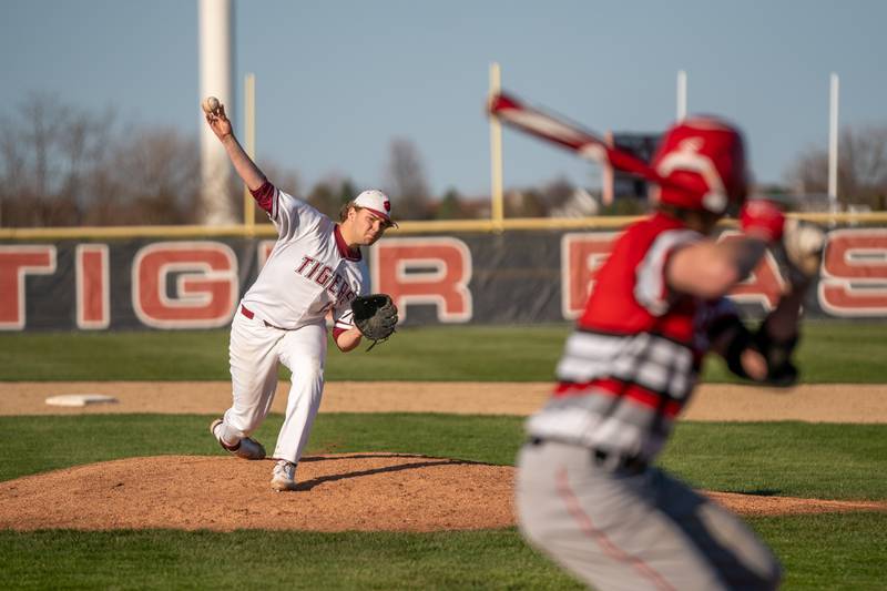 Plainfield North's Thomas Fitzgerald (13) delivers a pitch against Yorkville during a baseball game at Plainfield North High School on Thursday, April 21, 2022.