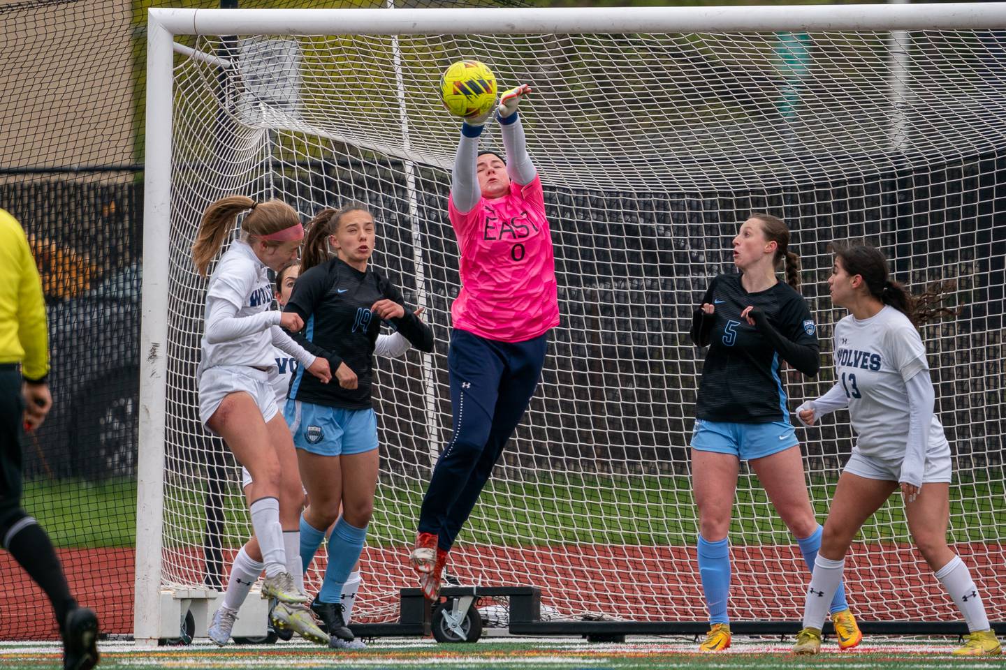 Oswego East's Samantha McPhee (0) goes up for a save against St. Charles North during a Naperville Invitational soccer match at Naperville Central High School on Saturday, April 22, 2023.