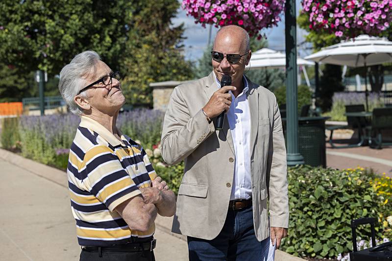 Councilman Mike Venier regales a story about John Groshans (left) during a ceremony Friday, Aug. 9, 2024 honoring John and his hard work with Heritage Crossing in Dixon.