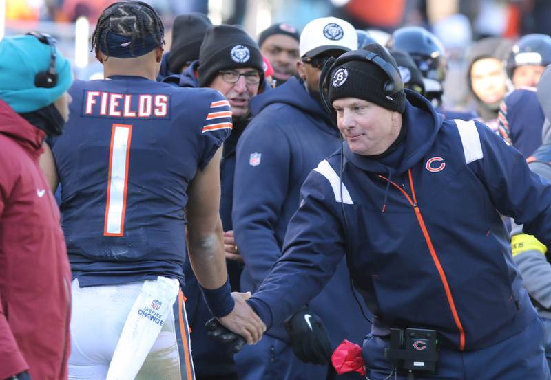 Chicago Bears head coach Matt Eberflus congratulates Chicago Bears quarterback Justin Fields after the offense scored a touchdown during their game Sunday, Dec. 18, 2022, at Soldier Field in Chicago.